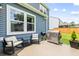 Back patio features stainless grill, seating, and well manicured shrubbery at 3010 Grinnell St, Johns Island, SC 29455