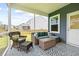 Outdoor living on the screened porch featuring wicker seating at 3010 Grinnell St, Johns Island, SC 29455