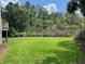 Spacious lawn with mature trees and views of the marsh at 324 Wild Horse Ln, Mount Pleasant, SC 29464
