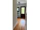 Inviting entryway with hardwood floors, and shiplap walls, with decorative mirror and plant at 324 Wild Horse Ln, Mount Pleasant, SC 29464