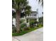 Two-story home with white siding, black shutters, surrounded by beautiful greenery at 324 Wild Horse Ln, Mount Pleasant, SC 29464