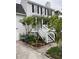 Charming two-story home with landscaped yard, white stairs, and inviting front porch at 324 Wild Horse Ln, Mount Pleasant, SC 29464