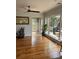 Bright living room featuring hardwood floors and sliding glass doors to the deck at 324 Wild Horse Ln, Mount Pleasant, SC 29464