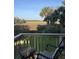 Enjoy a stunning marsh view from this home's deck, complemented by swaying palm trees and green grass below at 324 Wild Horse Ln, Mount Pleasant, SC 29464