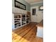 Mudroom with pine floors, built-in shelving and storage, and bench at 324 Wild Horse Ln, Mount Pleasant, SC 29464