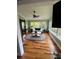 Bright sun room with ample natural light, plush seating and nature views at 324 Wild Horse Ln, Mount Pleasant, SC 29464