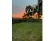 Scenic backyard at sunset with beautiful sky with trees and palm trees at 324 Wild Horse Ln, Mount Pleasant, SC 29464