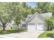 Beautiful home featuring a two-car garage, black shutters, and a well-manicured lawn at 350 Arlington Dr, Charleston, SC 29414