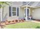Inviting front entrance with manicured flowerbeds and a charming address display at 350 Arlington Dr, Charleston, SC 29414