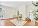 Bright room featuring a vintage desk, hardwood floors, and view to fenced backyard at 350 Arlington Dr, Charleston, SC 29414