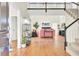 Bright living room featuring a high ceiling, staircase, and hardwood floors at 350 Arlington Dr, Charleston, SC 29414