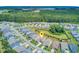 Aerial view of the homes and neighborhood highlighted by a central pinpoint, with a large wooded area in background at 366 Tupelo Lake Dr, Summerville, SC 29486