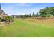 Expansive backyard with a well-manicured lawn complemented by mature trees and landscaping at 366 Tupelo Lake Dr, Summerville, SC 29486