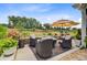 Picturesque patio featuring a comfortable seating area with an umbrella and landscaped garden at 366 Tupelo Lake Dr, Summerville, SC 29486