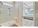 Beautiful bathroom showing the glass shower with built in bench and views into the primary bedroom at 366 Tupelo Lake Dr, Summerville, SC 29486