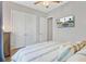 Inviting bedroom features a mounted TV, and view of the double closets and hall at 366 Tupelo Lake Dr, Summerville, SC 29486