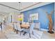 Stylish dining room features an accent wall, hardwood floors, modern lighting, and comfortable seating at 366 Tupelo Lake Dr, Summerville, SC 29486
