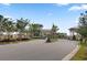Welcoming community entrance gate with meticulously landscaped greenery and trees enhancing curb appeal at 366 Tupelo Lake Dr, Summerville, SC 29486