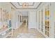 Bright foyer with wood floors, decorative ceiling and glass paneled doors at 366 Tupelo Lake Dr, Summerville, SC 29486