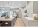 Bright, modern kitchen featuring a large island, stainless steel appliances, and light wood floors at 366 Tupelo Lake Dr, Summerville, SC 29486