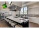 Bright, open kitchen features a large island with seating, stainless steel appliances, and white cabinetry at 366 Tupelo Lake Dr, Summerville, SC 29486