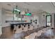Open community kitchen featuring modern stainless appliances and expansive island with seating and TVs above at 366 Tupelo Lake Dr, Summerville, SC 29486