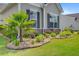 Close-up of exterior stone and lush landscaping with garden lights at 366 Tupelo Lake Dr, Summerville, SC 29486
