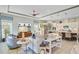Open-concept living room flows into a modern kitchen, featuring lots of seating and natural light at 366 Tupelo Lake Dr, Summerville, SC 29486