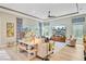 Bright living room with stylish decor, large windows, hardwood flooring and a large flatscreen television at 366 Tupelo Lake Dr, Summerville, SC 29486