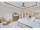 Bright main bedroom features a decorative ceiling, ceiling fan, light hardwood floors, and matching dresser at 366 Tupelo Lake Dr, Summerville, SC 29486
