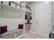 Organized mudroom with a bench, hooks, and shelves, perfect for storing outdoor essentials and accessories at 366 Tupelo Lake Dr, Summerville, SC 29486