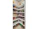 Well-stocked pantry with white shelves and ample storage for canned goods, spices, and other kitchen staples at 366 Tupelo Lake Dr, Summerville, SC 29486
