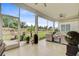 Inviting screened-in patio with comfortable seating and serene views of the landscaped backyard at 366 Tupelo Lake Dr, Summerville, SC 29486
