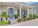 Welcoming front porch with cozy seating and beautiful landscaping at 366 Tupelo Lake Dr, Summerville, SC 29486