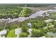 Aerial shot showcases the marsh, river and property with private dock at 3998 Capensis Ln, Ravenel, SC 29470