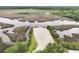Aerial view of a marsh with river and a sandy beach area at 3998 Capensis Ln, Ravenel, SC 29470