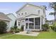 Charming home features a screened-in porch and patio, perfect for enjoying the outdoors at 3998 Capensis Ln, Ravenel, SC 29470
