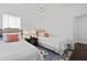 Comfortable bedroom featuring two twin beds, soft lighting, and light-colored decor at 3998 Capensis Ln, Ravenel, SC 29470