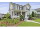 Charming home features a welcoming front porch with meticulous landscaping at 3998 Capensis Ln, Ravenel, SC 29470