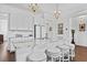 Bright kitchen island with granite countertops, barstool seating, and pendant lighting at 3998 Capensis Ln, Ravenel, SC 29470
