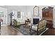 Elegant living room with a fireplace, beautiful mirror, and stylish furnishings at 3998 Capensis Ln, Ravenel, SC 29470