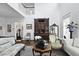 Grand living room with high ceilings, hardwood floors, and sophisticated furnishings at 3998 Capensis Ln, Ravenel, SC 29470