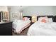 Cozy bedroom with two twin beds, wood floors, and complementary decor at 410 Yacht Harbor Ct # 410, Isle of Palms, SC 29451