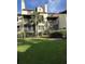 Multi-story building with balconies, awnings, and well-maintained landscaping, offering a blend of comfort and curb appeal at 410 Yacht Harbor Ct # 410, Isle of Palms, SC 29451