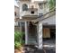 Exterior view of a two-story home with a covered golf cart parking area and stairs to the living quarters at 410 Yacht Harbor Ct # 410, Isle of Palms, SC 29451