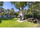 Outdoor grilling area with stainless steel grills, picnic table, and well-maintained green space at 410 Yacht Harbor Ct # 410, Isle of Palms, SC 29451
