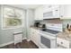 Bright kitchen features a window and modern appliances including a stove, microwave, and more at 410 Yacht Harbor Ct # 410, Isle of Palms, SC 29451