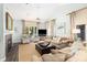 Living room with fireplace and comfortable seating, bathed in natural light at 410 Yacht Harbor Ct # 410, Isle of Palms, SC 29451