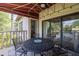 A covered outdoor patio with a table, chairs and a relaxing atmosphere at 410 Yacht Harbor Ct # 410, Isle of Palms, SC 29451
