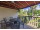 Outdoor patio with a wrought iron table, six chairs, and canopy coverage at 410 Yacht Harbor Ct # 410, Isle of Palms, SC 29451